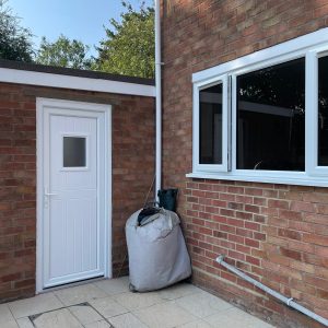 image of back door back of house white upvc door and white casement windows - Stafford uPVC